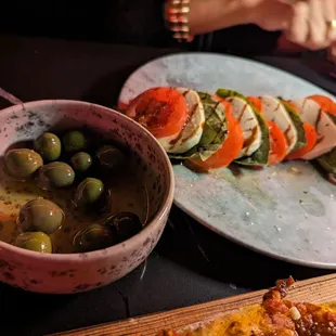 Olives, caprese salad