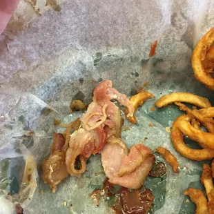 Undercooked bacon from the Big Foot Burger.