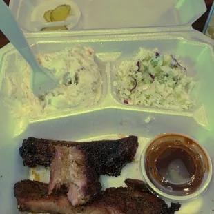 BBQ ribs, potato salad and coleslaw.