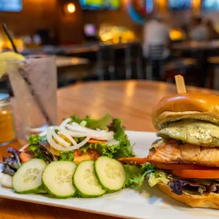 a plate with a sandwich and a salad