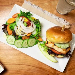 a plate with a sandwich and a salad