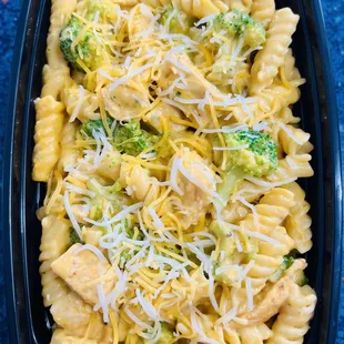 a pasta dish with chicken and broccoli