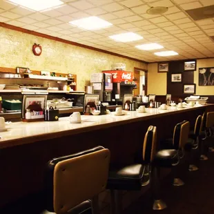 a diner's counter and chairs