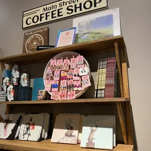 a shelf of coffee shop items