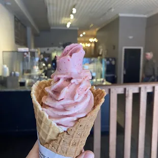 Strawberry mango ice cream in a waffle cone. SO good!!