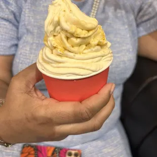 Single scoop cup with vanilla and peaches!