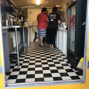 two people standing in the doorway