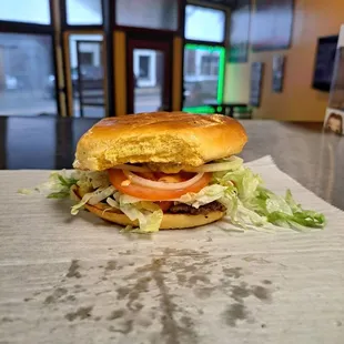 a sandwich with lettuce and tomato