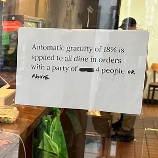 Forced Gratuity sign, only in the front register but not on the side.