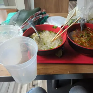 two bowls of soup and chopsticks