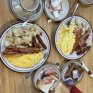 Hot Coffee, All American Special with home fries, bacon, sausage, scrambled eggs (one with cheese) and white and wheat toast.