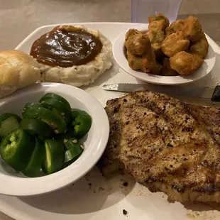 Pork chop dinner, okra, mashed potatoes with brown gravy, roll &amp; sliced jalapeños