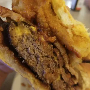 a hand holding a sandwich