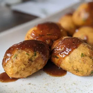 Akara.... They&apos;re more like fritters than dumplings. The sauce was sweet and tangy.