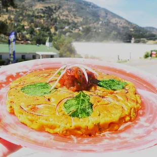 Indian Savory Pancake prepared with ingredients such as chickpea flour, select wh
