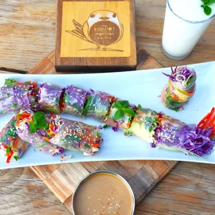 Asian Style Spring Rolls in a Bird Design: 
 with Julienne vegetables, Mint Leaves, and Seaweed Salad wrapped in  Rice Paper and served with