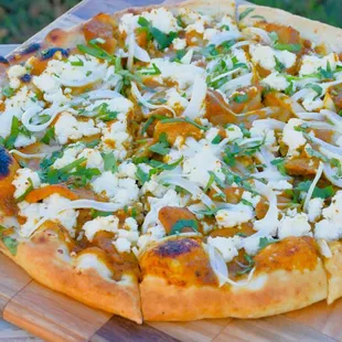 Chickenless Tikka Masala Pizza, made with authentic tikka masala sauce and savory plant-based chicken (with the taste and texture of rea