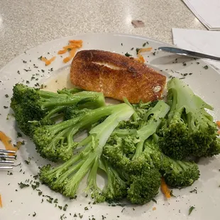 a plate of broccoli and fish