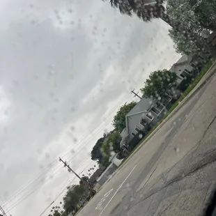 a view of a street through a car window