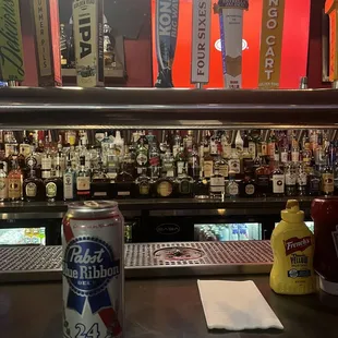 a can of beer on the bar
