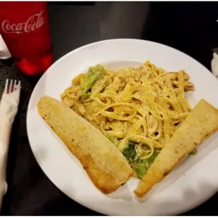 a plate of noodles and bread
