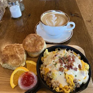 The Nest. Hash brown potatoes, sausage, scramble eggs, cheese, gravy with biscuits. Delicious.