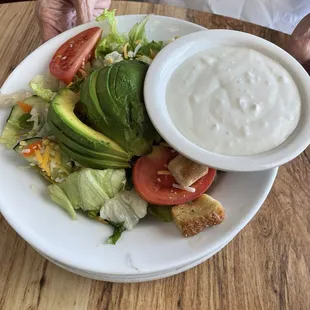Garden salad added avocado and cheese with blue cheese dressing.