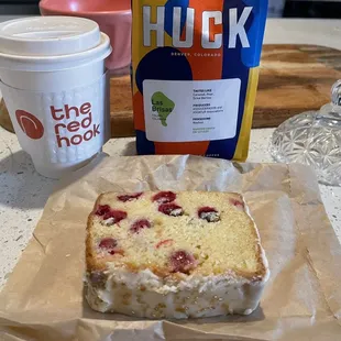Latte, ground coffee, and frosted cranberry loaf