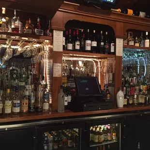 a bar filled with liquor bottles
