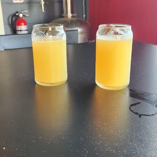 two glasses of beer on a table