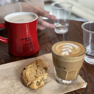 Half eaten cookie with a London fog and a cortado with my name written on it