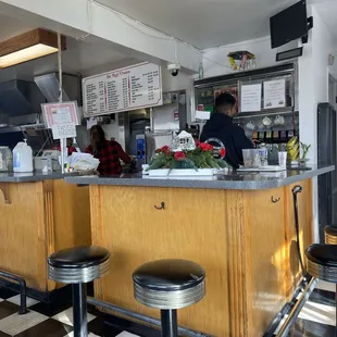 a restaurant with a checkered floor