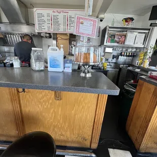 a kitchen with black and white checkered floor