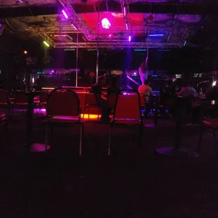 a man playing a guitar in the dark