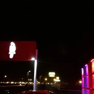 a neon sign in the dark