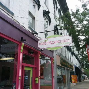 a woman walking down the sidewalk
