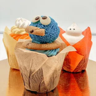 a cupcake with a cookie monster on top