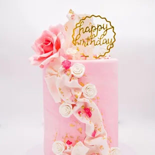 a pink birthday cake