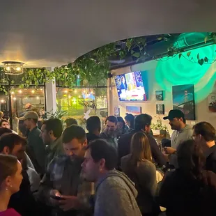 a large group of people at a bar