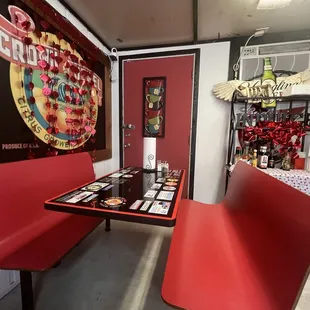 a red booth and a red table