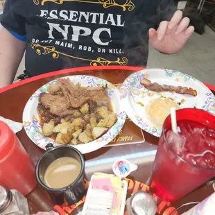 This was called the brisket breakfast including the home fries with onions bacon and also a side of sausage gravy with the biscuit.