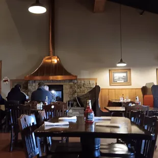 people sitting at tables in a restaurant