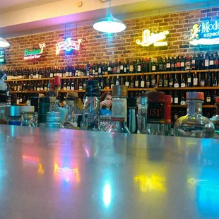 a bar with neon signs