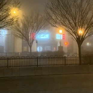 a foggy street at night