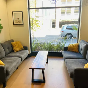 a living room with couches and a coffee table
