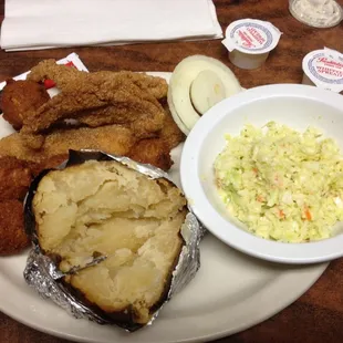 The Thursday night special. 3 catfish filets, baked potato, hush puppies, slaw, and onion. Less than 10 bucks. Come on!!