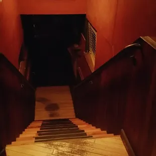 Step downstairs to the redwood room.