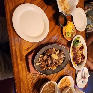 Charro beans, carnitas , pastor tacos chips and salsa