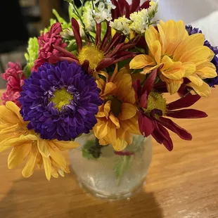 Tables adorned with fresh flowers in fall colors