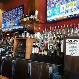 full bar with plenty of tvs